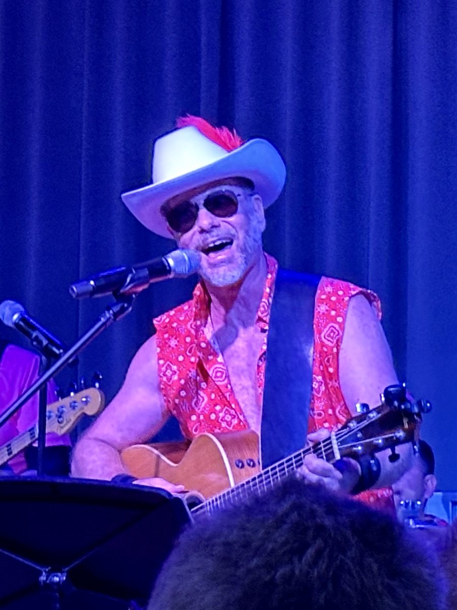 Peter Fogel singing and playing guitar